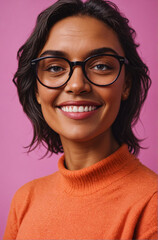 Fototapeta premium A woman wearing glasses smiles at the camera.