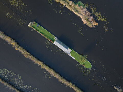 loosdrechtse plassen, water village, house on water, nature of The Netherlands. Breukelen, Scheendijk, aerial drone view.