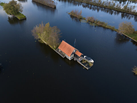 loosdrechtse plassen, water village, house on water, nature of The Netherlands. Breukelen, Scheendijk, aerial drone view.
