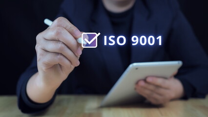 ISO 9001 Standard certification standardization quality control concept.business technology concept Touch on screen with ISO icon and globe on smart background.