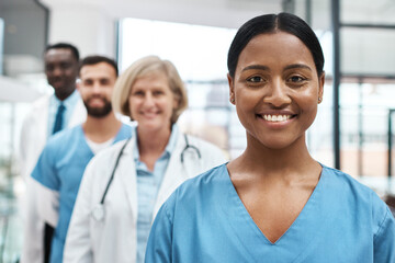 Fototapeta premium Hospital, doctors and woman nurse in portrait with smile, confidence and support in healthcare. Happy, solidarity and medical team with leadership, trust and diversity with group of clinic staff