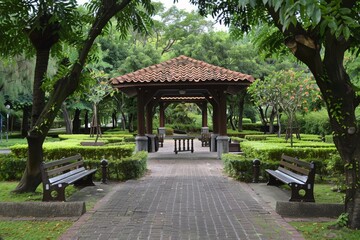 Fototapeta premium Serene Park with Pavilions and Lush Green Landscape