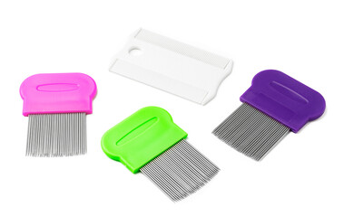 Colorful plastic and metal combs on a white background