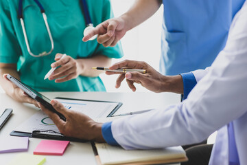 Meeting of doctors and medical personnel in hospitals to discuss research on disease treatment.