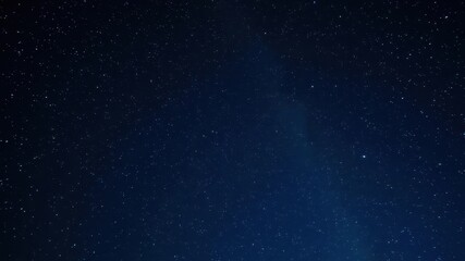 Fototapeta premium Twinkling stars scattered across a deep blue night sky, background, twinkling, sky