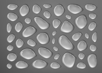 Dense pattern of water droplets on a dark gray background