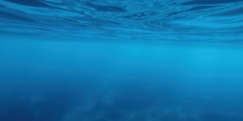 Subtle ripples and swirls create a mesmerizing deep blue sea texture, underwater, surface, wave