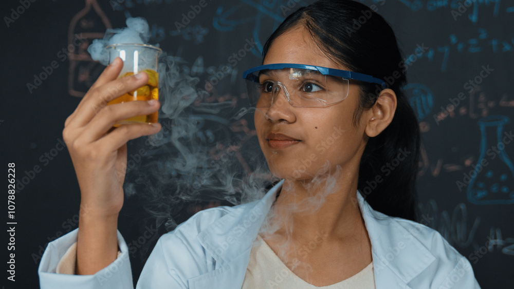 Aufkleber closeup of smart highschool student inspect colored solution at blackboard. beautiful scientist hold
