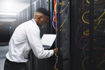 Man, technician and server room with laptop screen for network repair or hardware fault at data center. Male person, IT engineer or computer for technical issue, internet service or system backup