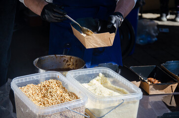 Close-up of the process of cooking food in an outdoor open kitchen