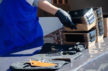Close-up of prepared food placed in containers at an outdoor open kitchen