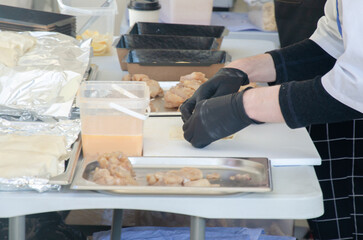 Close-up of the process of cooking food in an outdoor open kitchen