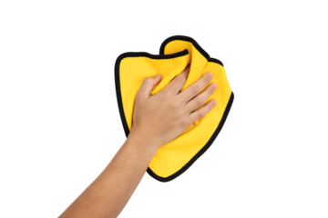 Closeup of hand holding yellow rag and wiping table, wall or floor surface in kitchen, bathroom or other room isolated on white background with clipping path.