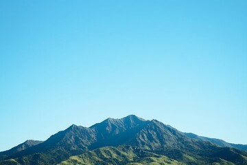 A breathtaking mountain range with a clear blue sky. Perfect for adventure and travel-themed projects.
