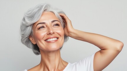 Fototapeta premium Woman with radiant, flawless skin and gray hair, ageless beauty, timeless sophistication and grace