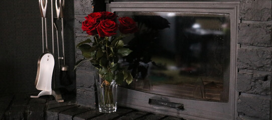 dark interior with red roses  near a stone