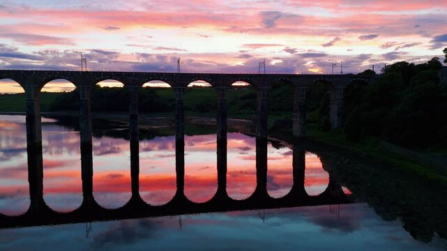 Berwick, Northumberland, UK, June 19, 2024; sunset rise up reveal aerial clip of the Royal Border Bridge Viaduct, Berwick, Berwick-upon-Tweed, Northumberland, England, UK.