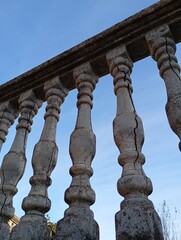 Fototapeta premium old fence with balusters against the sky