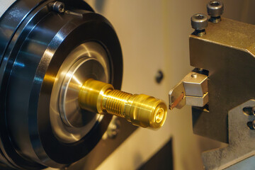 Close up scene the CNC lathe machine slot cutting at the brass pipe coupling parts.