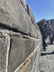 Beijing, China - October 19, 2024 stone on the Great Wall of China with engravings, capturing...