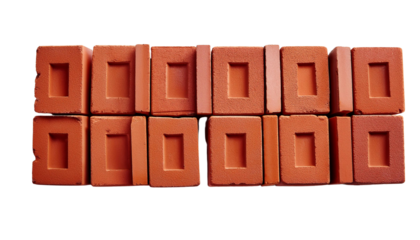 Array of red construction bricks neatly arranged for building projects and architectural designs.