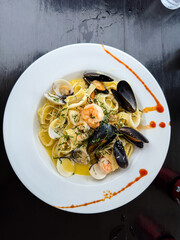 Closeup view of the of a seafood pasta plate with Shrimp and clams