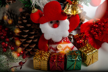 Decoration details of a Christmas tree decorated in red and gold.