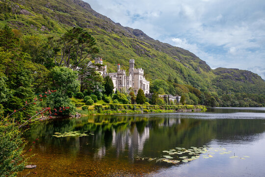 Kylemore Abbey with water reflections in Connemara, County Galway, Ireland, Europe. Benedictine monastery founded 1920 on the grounds of Kylemore Castle. Mainistir na Coille Moire