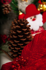 Decoration details of a Christmas tree decorated in red and gold.
