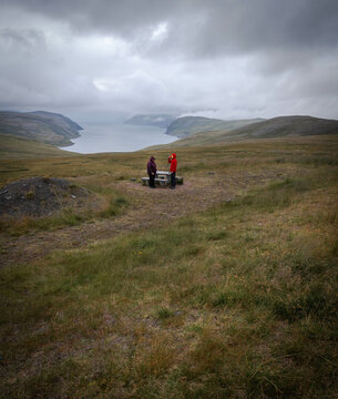 Two persons in vast tundra landscape on Mager&oslash;ya island, Norway