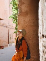 A Chinese woman sightseeing in the old streets of the ancient city of Kashgar, Xinjiang, China