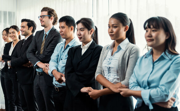 Modern diversity and multicultural company, business people joining hand together and standing in line, shared commitment to collaboration and cooperation concept background. Meticulous