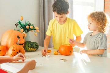 Three real siblings two brothers and one sister having fun together while preparing to Halloween at...