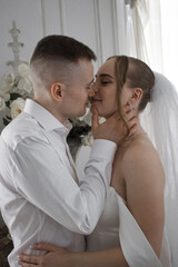 Newlyweds guy and girl. Wedding. White dress. Happiness.