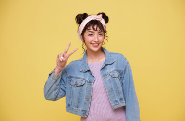 Young asian cute woman wearing casual clothes smiling looking to the camera showing fingers doing...