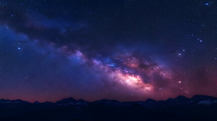 Obraz premium A Stunning Night Sky Displaying the Milky Way Galaxy Above a Silhouette of Mountain Peaks