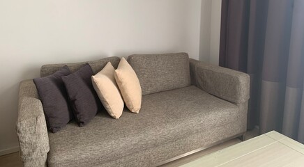 beautiful and comfortable pillows decoration gray sofa in living room