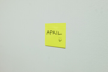 April sign on a sticky note.