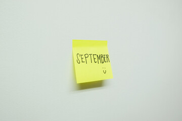 September sign on a sticky note.