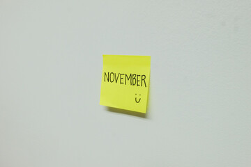 November sign on a sticky note.