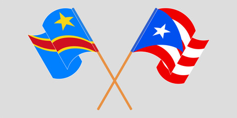 Crossed and waving flags of Democratic Republic of the Congo and Puerto Rico. Vector illustration