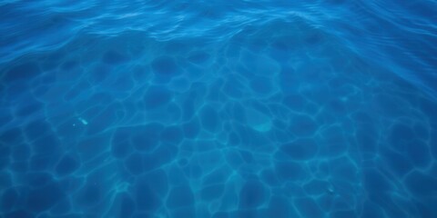 Obraz premium Swirling patterns of deep blue sea water with a shimmering texture, deep, ocean, summer