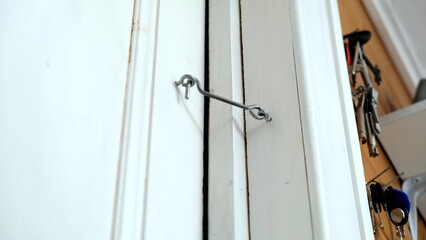 Screen door and attached hook latch with eye