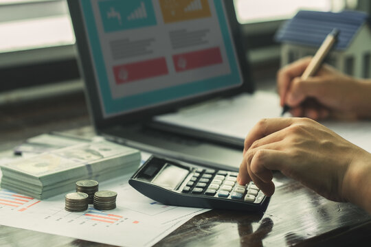 People are using computer to do online financial transactions such as debt, investment, calculation. Retro photo of economic downturn, stress.