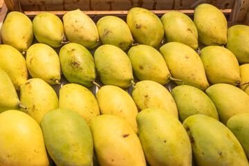 The background of the food, the texture of the green mango in the food store.
