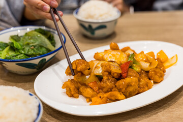 Cantonese style cuisine sweet and sour pork in the restaurant