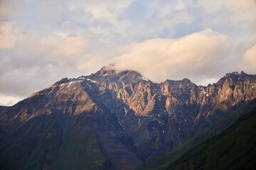 Obraz premium Mountain peaks in Georgia at sunset. Natural beauty. The time of the year is summer
