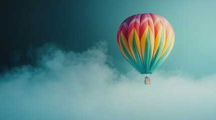 Naklejka premium Vibrant colorful hot air balloon drifting amidst ethereal wispy clouds in a scenic majestic landscape The balloon s unique multicolored design adds a sense of whimsy and wonder to the tranquil