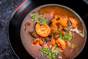 Spicy Seafood Soup with Fresh Cilantro Garnish