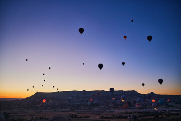 Balloons lifted into the air in Cappadocia. Entertainment and tourist attraction. A spectacular sight